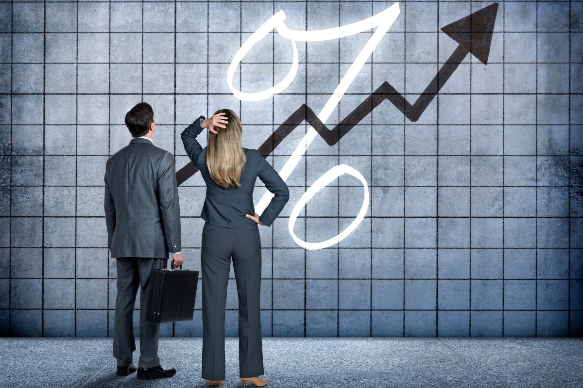 Business Man And Woman Interest Rate Increases