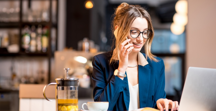 Business Woman Talking On Phone With Laptop